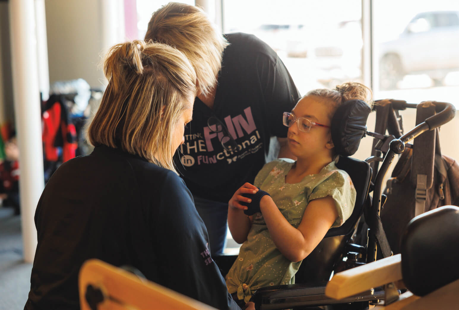 Provider caring for child in wheelchair